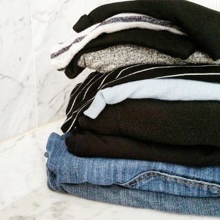 Stack of unwanted clothes ready to donate to a clothes bank